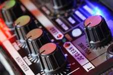 close-up of controls on mixing desk