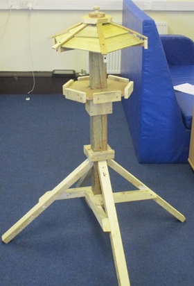 Wooden handmade birdtable. Birdtable.