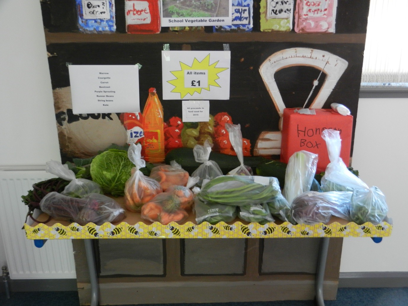 photograph of vegetable stall with bagged and loose vegetables