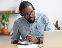 Man with headphones to indicate webinar recordings and audio-narrated presentations